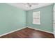 Cozy bedroom with a window and hardwood floors at 1248 To Lani Ct, Stone Mountain, GA 30083