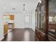 Bright dining area featuring hardwood floors, a modern light fixture, and an antique china cabinet at 1248 To Lani Ct, Stone Mountain, GA 30083