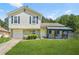 Charming two-story home with a well-maintained lawn, stone accents, and a covered front porch at 1248 To Lani Ct, Stone Mountain, GA 30083