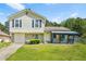 Charming two-story home with a well-maintained lawn, stone accents, and a covered front porch at 1248 To Lani Ct, Stone Mountain, GA 30083