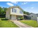 Charming two-story home with a one-car garage, landscaped yard, and a covered porch at 1248 To Lani Ct, Stone Mountain, GA 30083