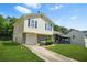 Charming two-story home with a one-car garage, landscaped yard, and a covered porch at 1248 To Lani Ct, Stone Mountain, GA 30083