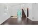 Inviting living room with hardwood floors, staircase, and abundant natural light at 1248 To Lani Ct, Stone Mountain, GA 30083