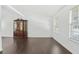 Spacious living room featuring hardwood floors, a large window, and bright, white walls at 1248 To Lani Ct, Stone Mountain, GA 30083