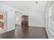 Spacious living room featuring hardwood floors, a large window, and bright, white walls at 1248 To Lani Ct, Stone Mountain, GA 30083