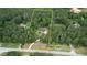 Aerial view showing the property's boundaries, highlighting its expansive lot and wooded privacy at 1761 Mcdaniel Mill Rd Sw, Conyers, GA 30094