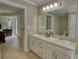 En-suite bathroom with double sink vanity and access to the bedroom at 1761 Mcdaniel Mill Rd Sw, Conyers, GA 30094