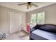 This bedroom features a crib, a daybed and a large window that lets in plenty of natural light at 1761 Mcdaniel Mill Rd Sw, Conyers, GA 30094