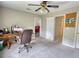 Bedroom with ceiling fan, desk and access to other rooms at 1761 Mcdaniel Mill Rd Sw, Conyers, GA 30094