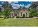 Charming home with stone accents, manicured lawn and mature trees at 1761 Mcdaniel Mill Rd Sw, Conyers, GA 30094