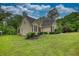Well-maintained home with lush lawn and landscaping at 1761 Mcdaniel Mill Rd Sw, Conyers, GA 30094