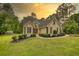 Charming home with stone accents, manicured lawn and mature trees at 1761 Mcdaniel Mill Rd Sw, Conyers, GA 30094