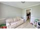 Cozy living room with hardwood floors adjacent to the kitchen at 1761 Mcdaniel Mill Rd Sw, Conyers, GA 30094