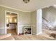 Living room with hardwood floors and access to staircase at 1761 Mcdaniel Mill Rd Sw, Conyers, GA 30094