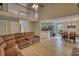 Living room showcases high ceilings, hardwood floors, and seamless connection to the dining area and kitchen at 1761 Mcdaniel Mill Rd Sw, Conyers, GA 30094