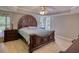 Spacious primary bedroom with hardwood floors and natural light at 1761 Mcdaniel Mill Rd Sw, Conyers, GA 30094