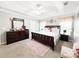 Inviting main bedroom with a decorative ceiling, plush carpet, and a beautiful sleigh bed at 3049 Battlement, Loganville, GA 30052