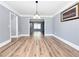 Inviting dining room with hardwood floors, stylish lighting, and a seamless connection to other living spaces at 3049 Battlement, Loganville, GA 30052
