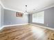 Bright dining room with hardwood floors, a modern light fixture, and a view to the outside at 3049 Battlement, Loganville, GA 30052