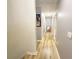 Bright hallway featuring neutral paint, wood-look floors, and decorative artwork at 3049 Battlement, Loganville, GA 30052