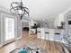 Open kitchen with counter seating, white cabinetry, and stainless steel appliances at 3049 Battlement, Loganville, GA 30052