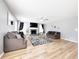 Spacious living room features wood floors, a fireplace, and plenty of natural light at 3049 Battlement, Loganville, GA 30052