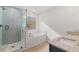 Well-lit bathroom with tub, glass enclosed shower, and double sink vanity at 5086 Cumberland Ct, Villa Rica, GA 30180