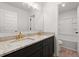 Double vanity bathroom with granite countertops and modern fixtures at 5086 Cumberland Ct, Villa Rica, GA 30180