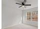 A spacious bedroom with natural light and ceiling fan at 5086 Cumberland Ct, Villa Rica, GA 30180