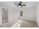 Bright bedroom features a ceiling fan and a window for natural light at 5086 Cumberland Ct, Villa Rica, GA 30180