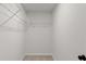 Walk-in closet with white walls and wire shelving for easy storage at 5086 Cumberland Ct, Villa Rica, GA 30180