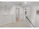 Hallway with plush carpet, laundry closet and views from second story at 5086 Cumberland Ct, Villa Rica, GA 30180