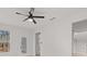 Bright living room featuring modern ceiling fan, large window, and light-colored walls at 5086 Cumberland Ct, Villa Rica, GA 30180
