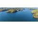 Breathtaking aerial view of a vast, tranquil blue lake surrounded by green islands at 6255 Lakeview Dr, Buford, GA 30518
