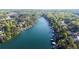Stunning aerial view of lakefront homes, surrounded by lush greenery, offering serene waterfront living at 6255 Lakeview Dr, Buford, GA 30518