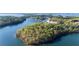 Scenic aerial shot of islands and waterways with docks, a beach, and boats at 6255 Lakeview Dr, Buford, GA 30518