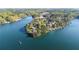 Panoramic aerial view of a lake with luxury homes and private boat docks at 6255 Lakeview Dr, Buford, GA 30518