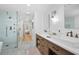 Bright bathroom featuring a double sink vanity, frameless glass shower, and hexagon tile flooring at 6255 Lakeview Dr, Buford, GA 30518