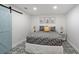 Charming bedroom with patterned tile floor, barn door, and stylish décor at 6255 Lakeview Dr, Buford, GA 30518