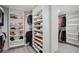 Walk-in closet with built in shelving units for clothes, shoes, and storage at 6255 Lakeview Dr, Buford, GA 30518