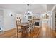 Inviting dining room features a modern chandelier and seamless flow to the kitchen at 6255 Lakeview Dr, Buford, GA 30518