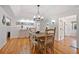 Spacious dining room featuring hardwood floors and white wainscotting at 6255 Lakeview Dr, Buford, GA 30518
