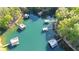 Aerial of multiple docks along lake showcasing private waterfront access at 6255 Lakeview Dr, Buford, GA 30518