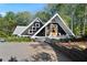 A-frame house with a welcoming front porch and modern design at 6255 Lakeview Dr, Buford, GA 30518