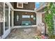 Inviting front porch with charming decor and stone accents at 6255 Lakeview Dr, Buford, GA 30518