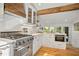 Well-lit kitchen featuring stainless steel appliances and white cabinetry at 6255 Lakeview Dr, Buford, GA 30518