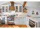 Bright kitchen with stainless steel appliances, wooden accents and white cabinets at 6255 Lakeview Dr, Buford, GA 30518