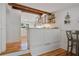 Bright eat-in kitchen area with white cabinetry and wooden accents at 6255 Lakeview Dr, Buford, GA 30518