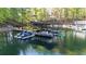 Picturesque lake view with boat dock and jet skis at 6255 Lakeview Dr, Buford, GA 30518