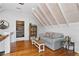 Comfortable living room featuring hardwood floors, a cozy sofa, and natural light at 6255 Lakeview Dr, Buford, GA 30518